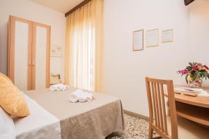 Postel nebo postele na pokoji v ubytování Hotel Oregon
