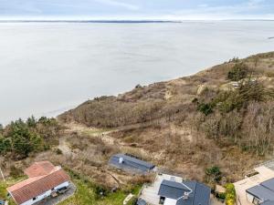 an aerial view of a house and the water at Holiday Home Heera - 100m to the fjord by Interhome in Lihme