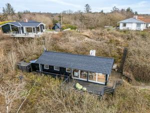 an aerial view of a house with a solar roof at Holiday Home Heera - 100m to the fjord by Interhome in Lihme
