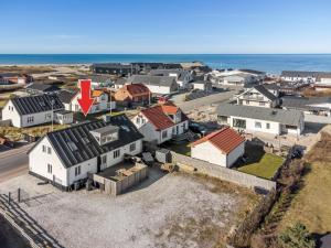 an aerial view of a town with houses and the ocean at Holiday Home Thilla - 100m from the sea by Interhome in Thisted