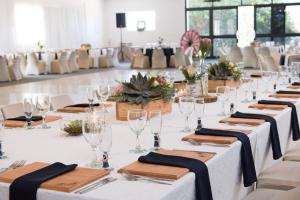 a table set up for a wedding with wine glasses at Heaven Can Wait Countryside Estate in Riversdale +40 photos