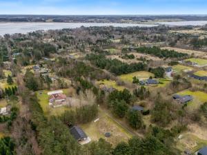 an aerial view of a subdivision with houses and trees at Holiday Home Aman - 700m to the fjord by Interhome in Højslev