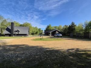 a car parked in front of a black building at Holiday Home Aswarth - 50m to the fjord by Interhome in Fur +20 photos