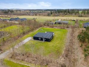 an overhead view of a black house in a field at Holiday Home Jarven - 500m to the fjord by Interhome in Højslev