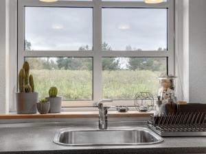a kitchen sink in front of a window at Holiday Home Christina - 300m to the inlet by Interhome in Storvorde