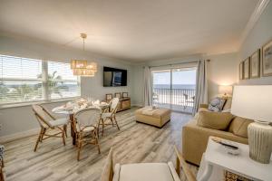 a living room with a table and a couch and a dining room at Vacation Villas #531 in Fort Myers Beach