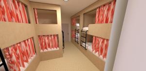 a room with two bunk beds and red paintings on the walls at Mustard Hostel in Dijon