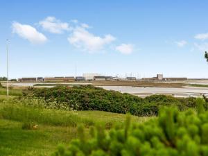 a view of a parking lot with a road and grass at Holiday Home Elpida - 100m from the sea by Interhome in Glesborg