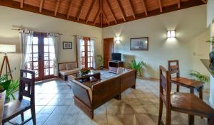 a living room with a couch and a table and chairs at Antigua Superyacht Marina & Resort in English Harbour Town