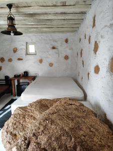 Postel nebo postele na pokoji v ubytování Artemis cottage