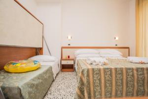 Postel nebo postele na pokoji v ubytování Hotel Oregon