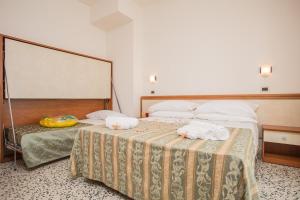 Postel nebo postele na pokoji v ubytování Hotel Oregon