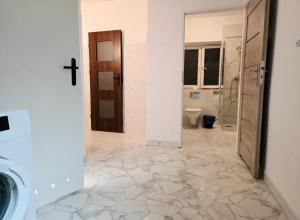 a bathroom with a sink and a toilet in a room at Lipowa Guest House in Bielawa +152 photos