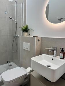 Ένα μπάνιο στο Haven Home Vienna Apartment