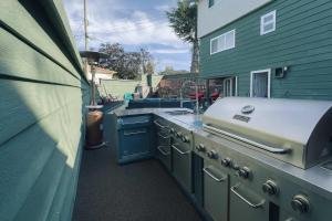 a outdoor kitchen with a stove and a sink at Hidden Oasis in Victoria, BC in Victoria