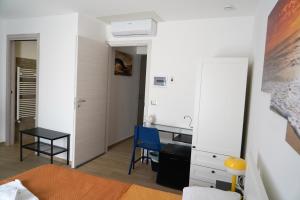 a bedroom with a desk and a bed and a desk at etna sea live catania center home in Catania