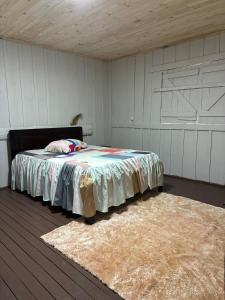 En eller flere senge i et værelse på Família, Natureza e Liberdade