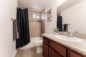 a bathroom with a sink and a toilet and a shower at Central PHX Deluxe 1 BR King Bed & Patio w Pool in Phoenix