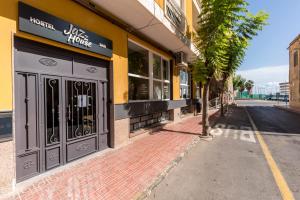 an empty street in front of a hotel at Jazz House in Torrevieja