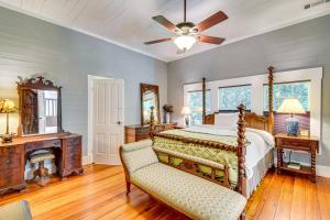 a bedroom with a bed and a ceiling fan at 30 Acres and Pond North Georgia Mtn Farmhouse in Demorest