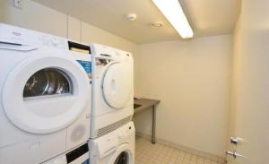 a washer and dryer in a laundry room at Levi Nordic Light in Levi