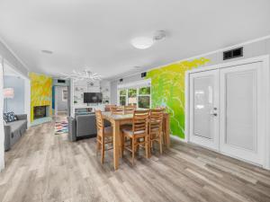 a kitchen and dining room with a table and chairs at Trendy & Relaxing - Close to Beach - Pool - Hot Tub in Sarasota