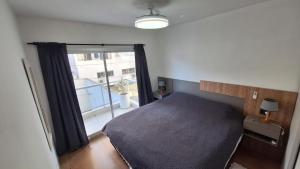 Ένα ή περισσότερα κρεβάτια σε δωμάτιο στο Departamento en la Mejor Zona de La Plata - Cochera Opcional
