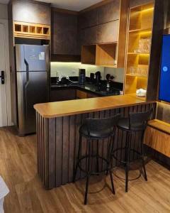 Kuchyň nebo kuchyňský kout v ubytování Flat exclusivo Studio Cuiabá 908