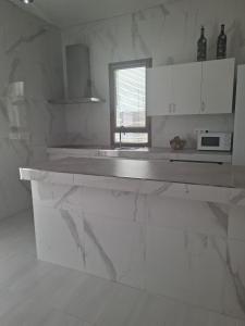Η κουζίνα ή μικρή κουζίνα στο Vivienda Rosa de los James SMC