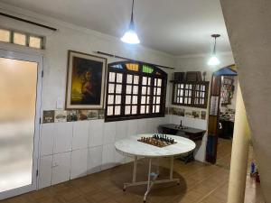 a room with a table in the middle of a room at Casa MISMA in Sao Paulo +25 photos