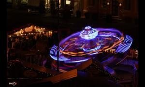 a blue lighted fountain in a city at night at Urlaub im Herzen Wismars Souterrain in Wismar