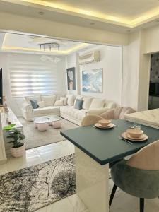 a living room with a couch and a table at Tahrir Retreat in Cairo +10 photos