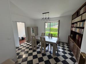 a dining room with a table and chairs at Bout du Haut in Saint-Blimont