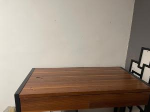 a wooden table in a room with two chairs at Chambre Ventabren avec mezzanine in Nîmes +1 photo