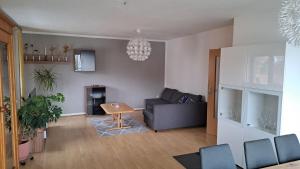 a living room with a couch and a table at Wohnung Brand in Neumarkt in der Oberpfalz