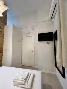 TV a/nebo společenská místnost v ubytování Hostal Alifornia Adultos