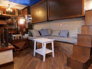 a living room with a couch and a table at La punta dell'Iceberg in Terminillo
