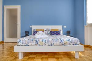 En eller flere senge i et værelse på Casa IDA