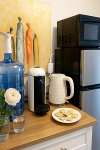 a counter with a coffee maker and a microwave at Private Double Room in Downtown Toronto, Steps to Subway & CN Tower in Toronto +8 photos