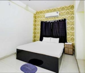 Katil atau katil-katil dalam bilik di Hotel O Sanskardhani Inn