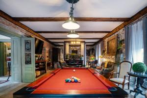 a pool table in the middle of a room at Veritas in Tokaj