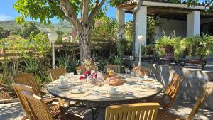 a table with food on it in a yard at La Casa de la Iglesia in La Umbría