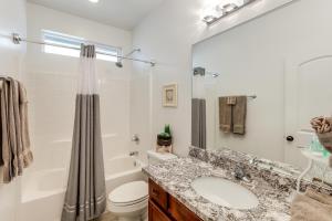a bathroom with a sink and a toilet and a shower at Ski, Hike and Explore Bellemont Home with Fenced Yard in Bellemont +17 photos