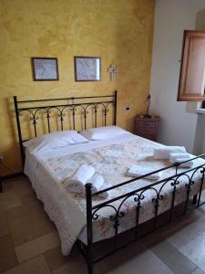 Ένα ή περισσότερα κρεβάτια σε δωμάτιο στο Villa Pugliese