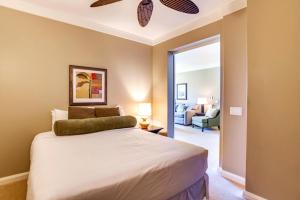 a bedroom with a bed and a living room at KBM Resorts Ocean Views Spacious 4-Bedroom Honua Kai Collection Multi Unit Listing Same Floor 2 Free Rental Cars HKH-41242 in Kaanapali Airport +34 photos