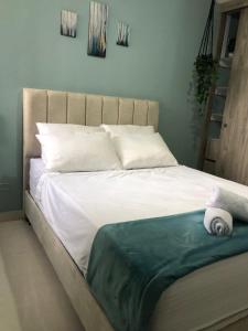 Ένα ή περισσότερα κρεβάτια σε δωμάτιο στο Apartmento, Barranquilla excelente ubicacion +5 φωτογραφίες