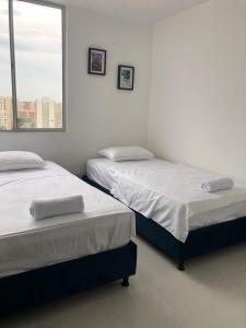 Ένα ή περισσότερα κρεβάτια σε δωμάτιο στο Apartmento, Barranquilla excelente ubicacion