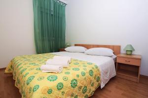 Ein Bett oder Betten in einem Zimmer der Unterkunft Apartments Lucija