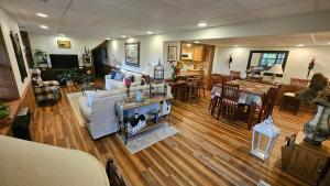 a living room with a couch and a dining room at Mountain View 2BR Log Cabin Apt wPrivate BBQ Deck in Sylva +28 photos