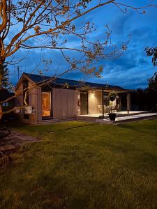 a house with a lawn in front of it at Domek Veli Stawinoga in Stawinoga +29 photos